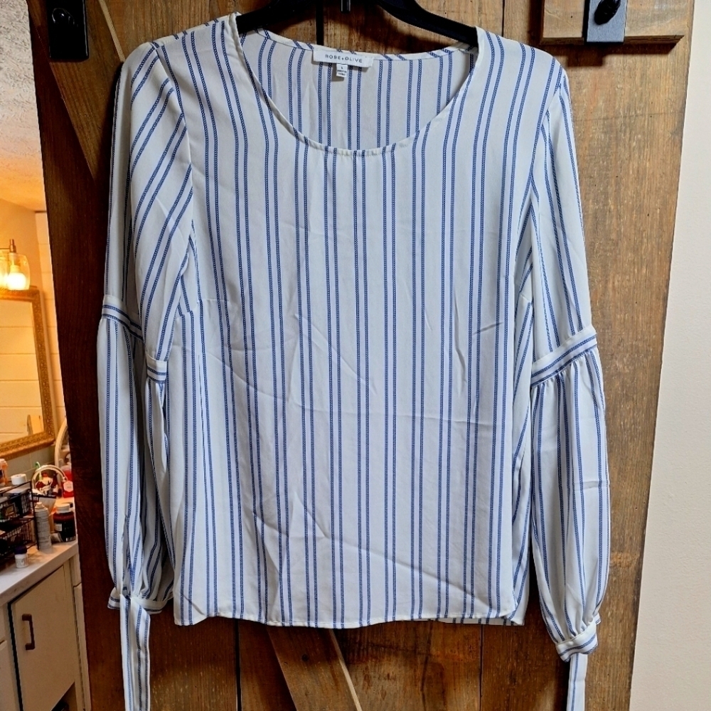 A Rose and Olive tunic top with waist ties in a size large. Vertical blue stripe